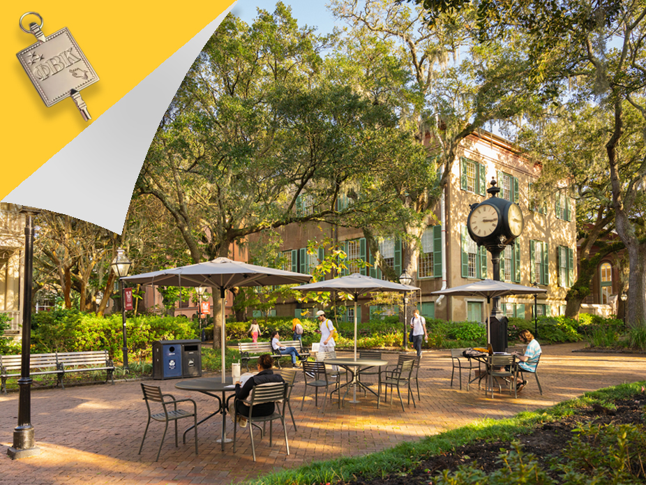 Students studying in the courtyard with a Phi Beta Kappa key in the corner of the image. The College  was granted a Phi Beta Kappa chapter in 2024.