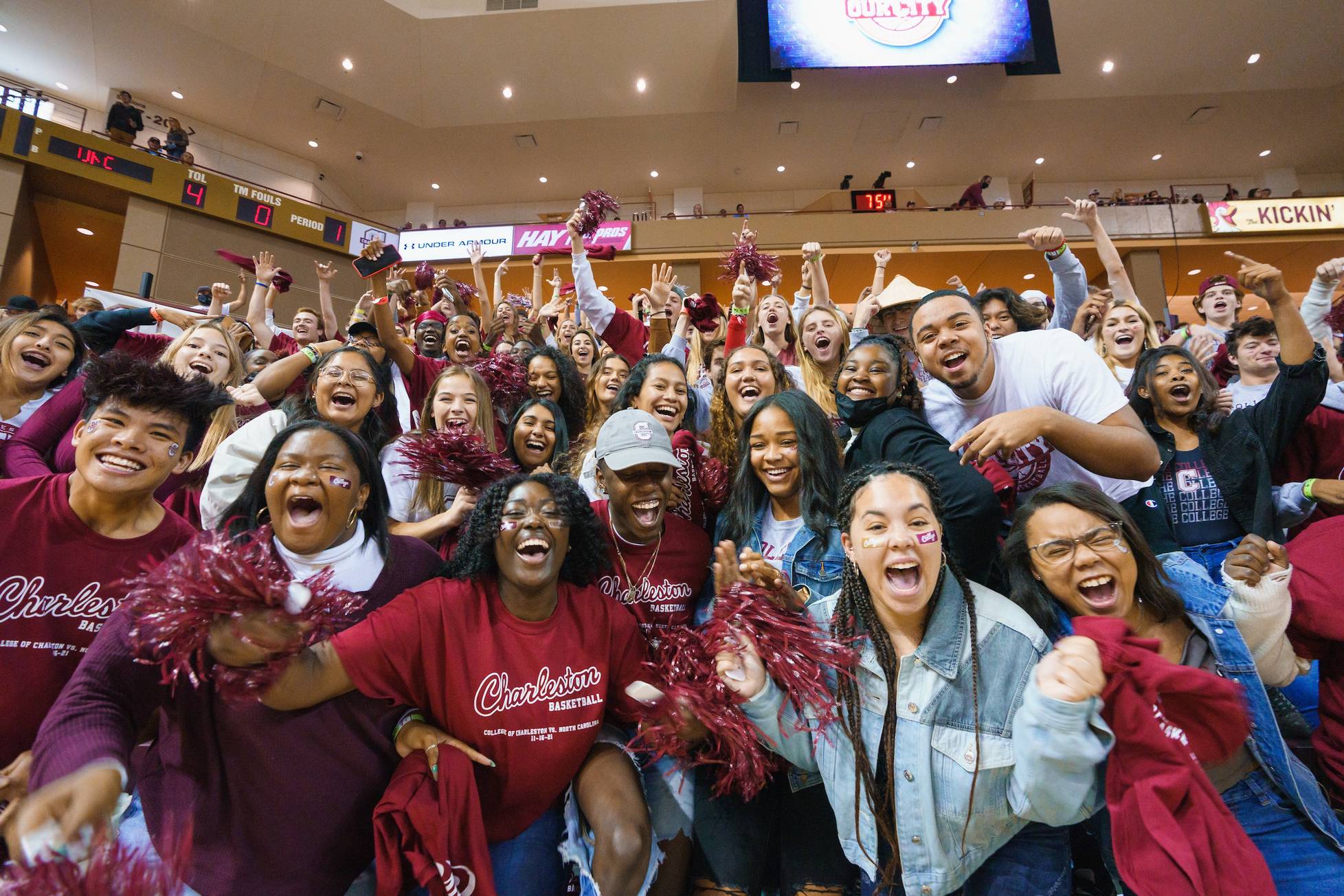 College of Charleston students cheering during a basketball game.
