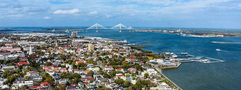 Arial view of Charleston with the Cooper River and Ravenel Bridge in the background
