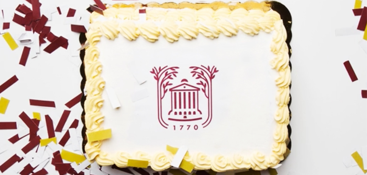 White sheet cake with College of Charleston logo