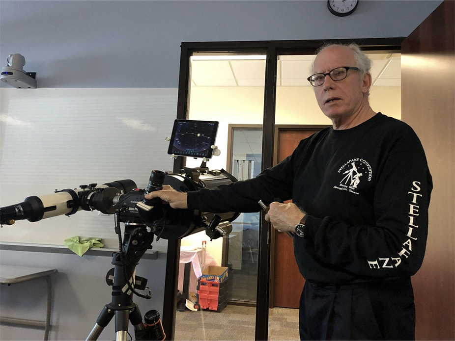 An instructor demonstrates the workings of a telescope at a C.A.L.L. course