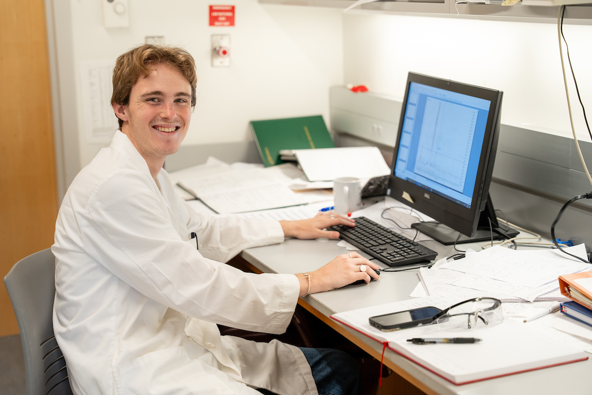 Research student Phillip Scott analyzes NMR spectra in Dr. Baker's lab (summer 2024)