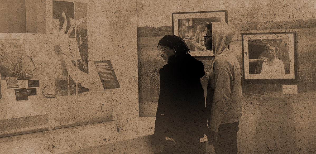 Stylized photo with a vintage look Two visitors view a display at the International African American Museum