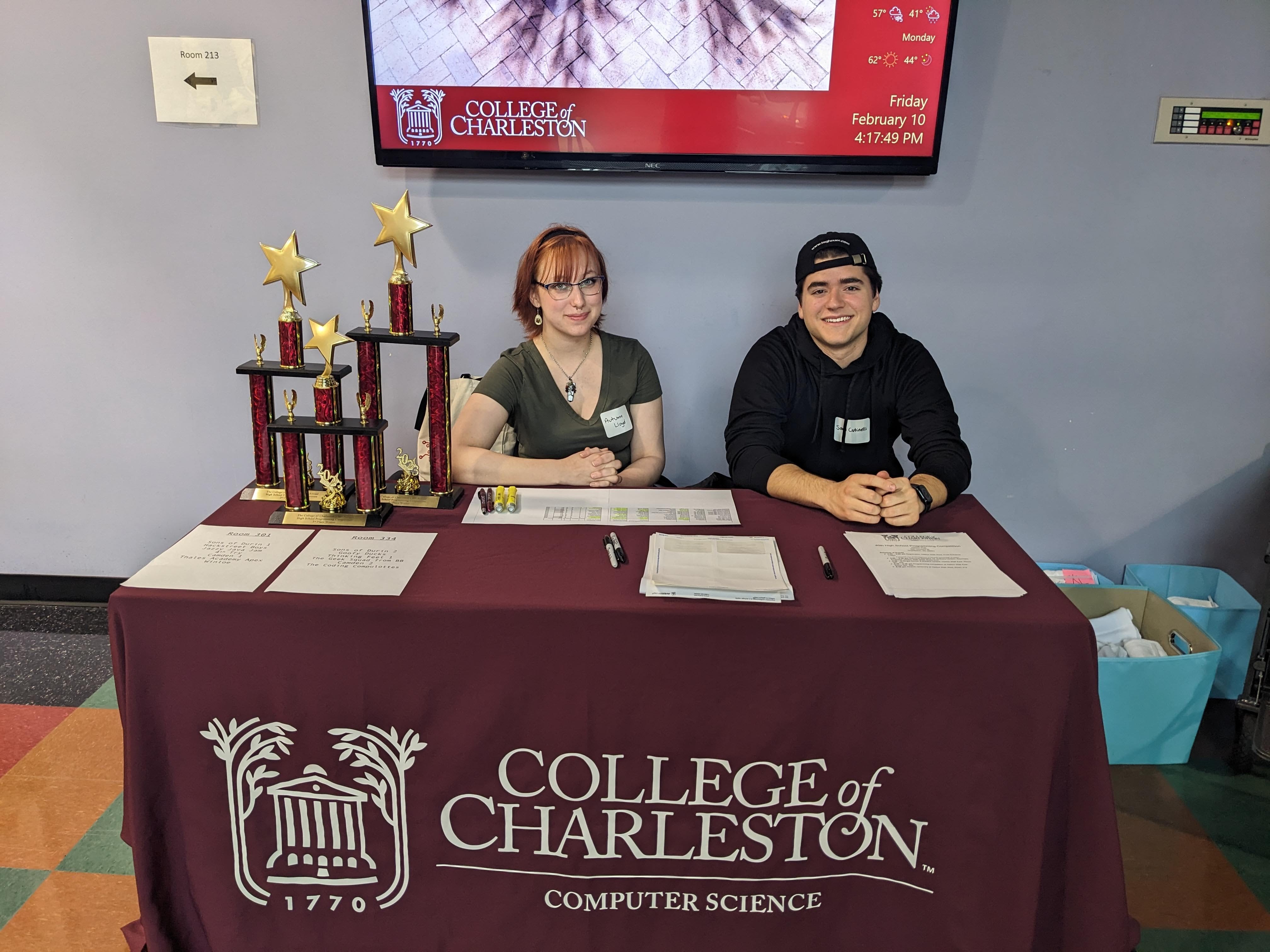 CofC students welcome competitors at the HS Programming Competition.