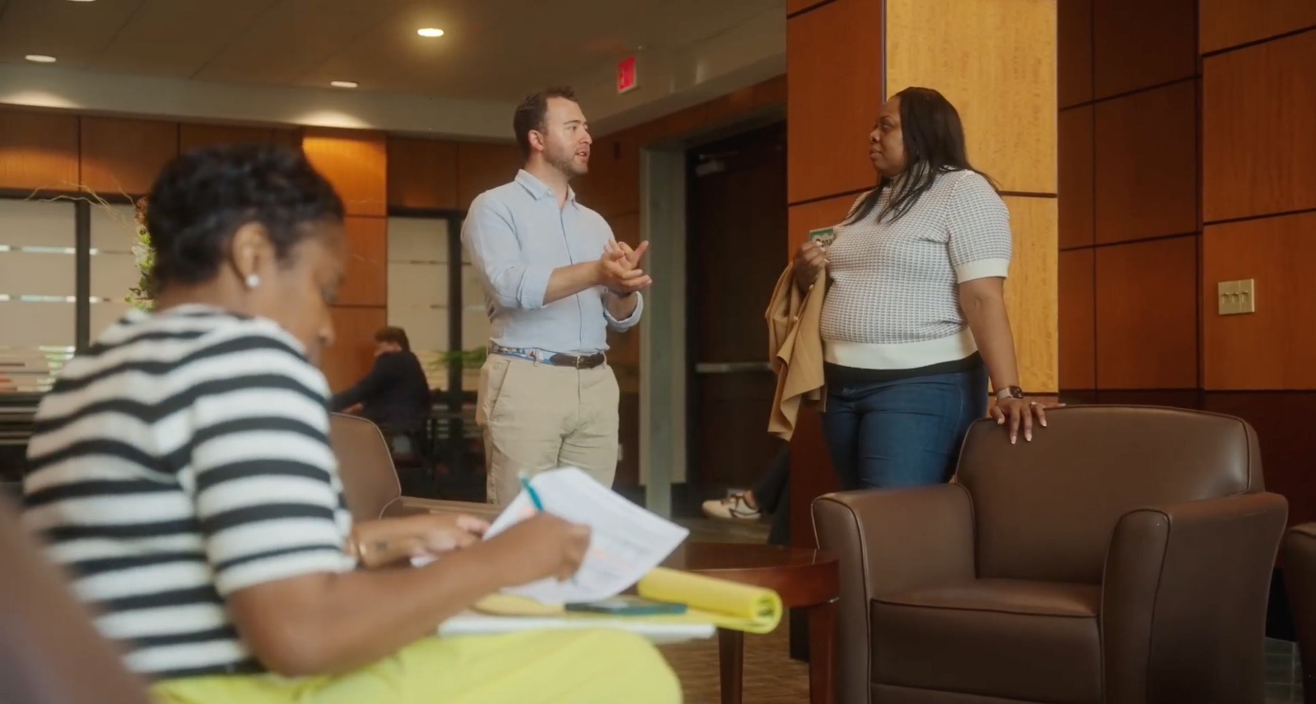 Students talking and writing in a dim room