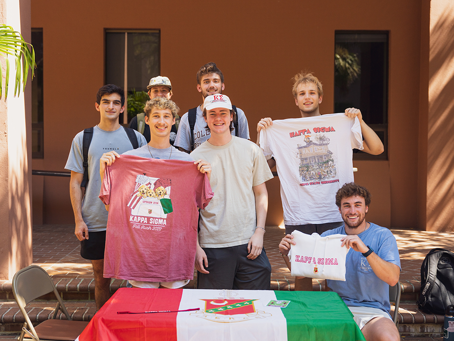 Fraternity men enjoying fall rush shirts and being outside together. 