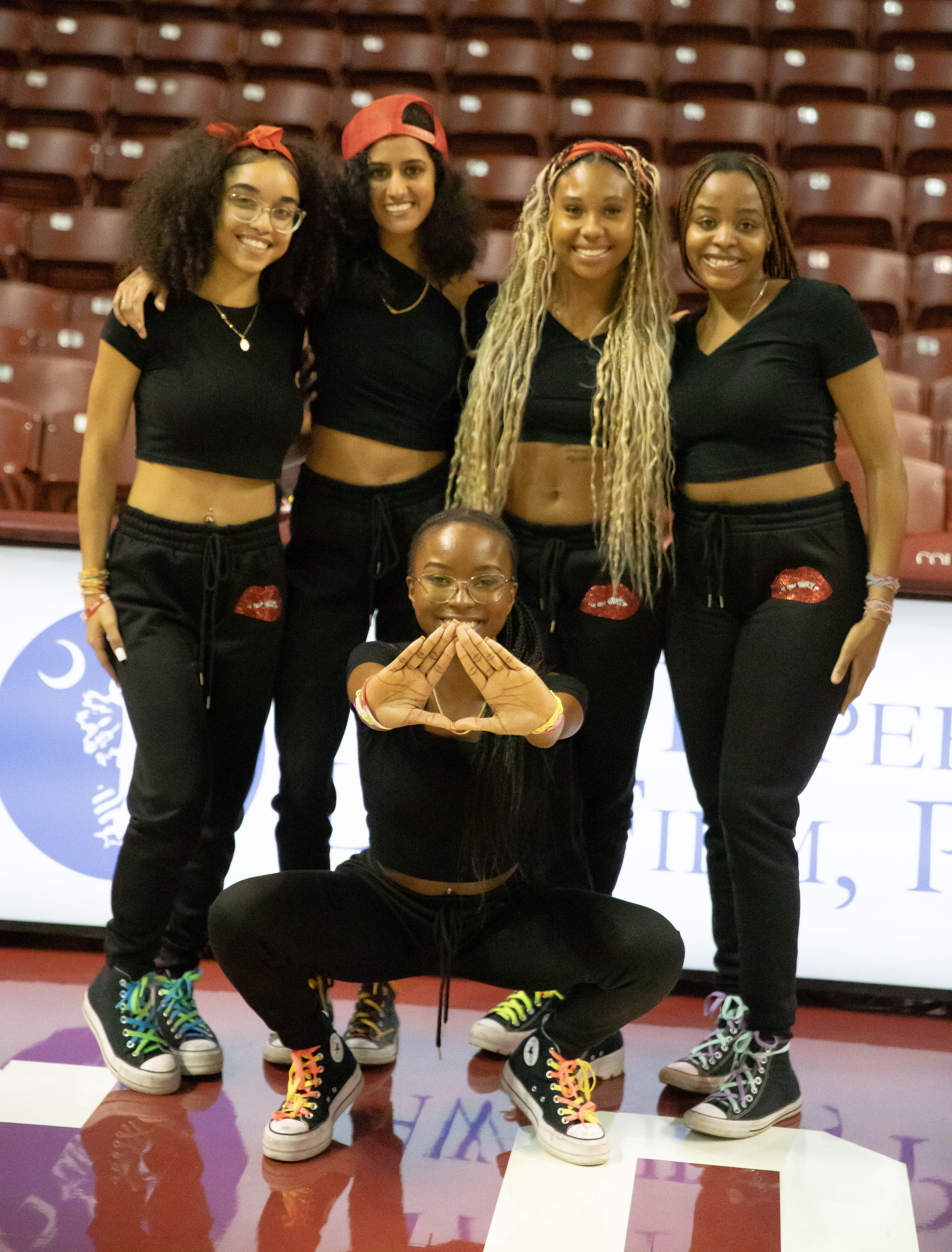 NPHC members doing celebrating pep supper and posing together.