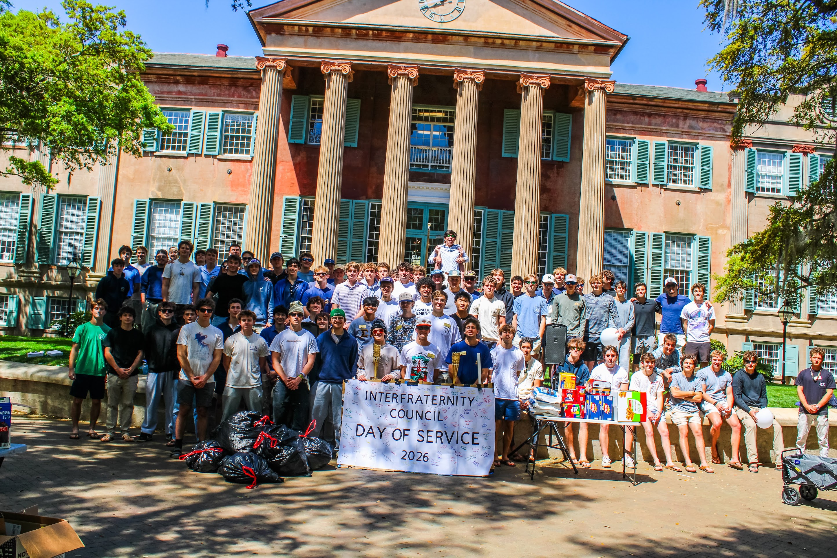 Large group of IFC men posing during weeks of service.