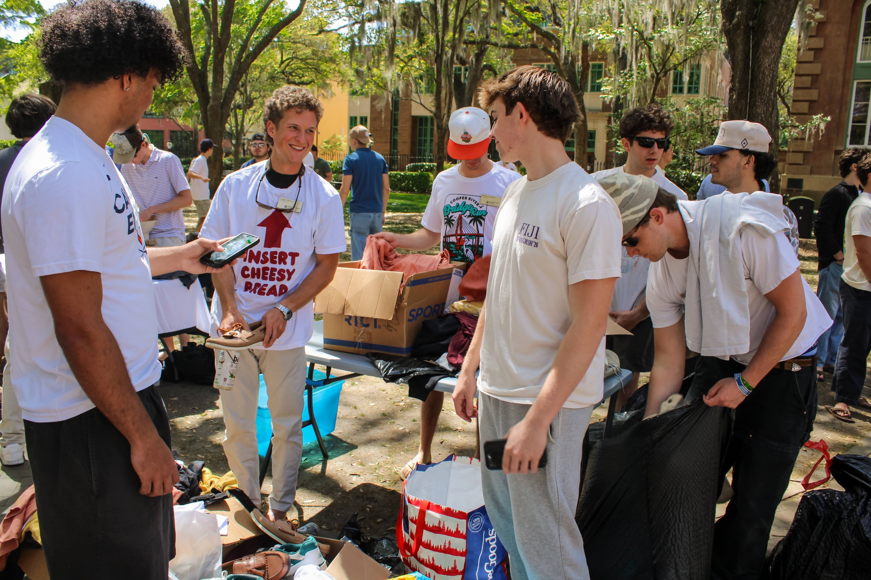 IFC men collecting donations for weeks of service. 