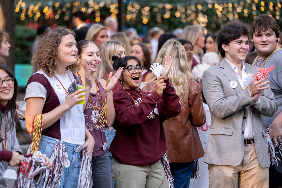 Honors students celebrate during the College's homecoming parade.