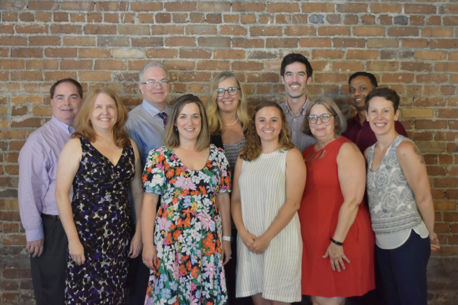 The Honors College staff pose for a photo during graduation 2024.