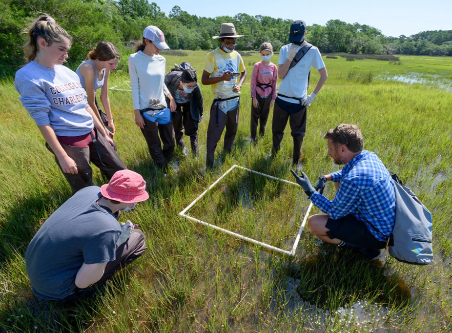 Visiting Assistant Professor of biology Chris Freeman leads students in field testing work at James Island County Park.