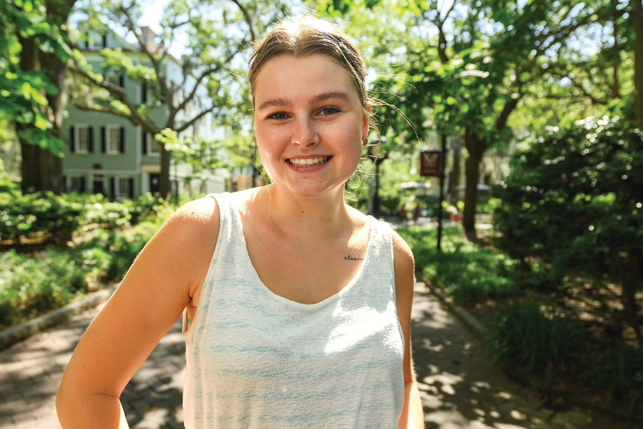 Honors College student Lea Neufeld smiles on campus.