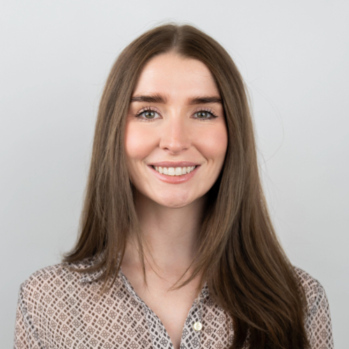A woman with brown hair smiling