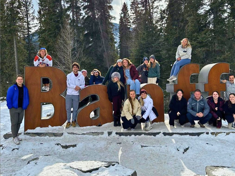 Students with Banff sign