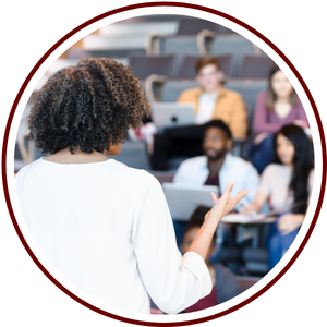 african american female professor in front of a classroom of students
