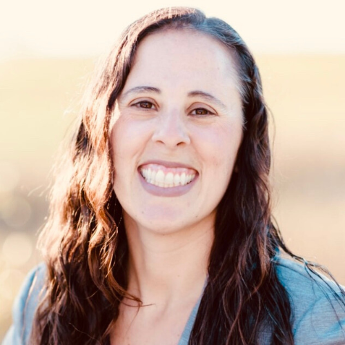 A woman with dark hair smiling