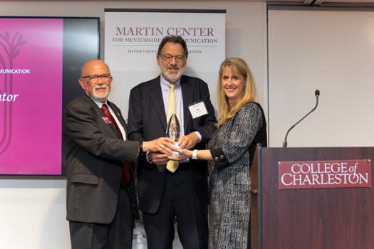 Dr. Beth Goodier and Tom Martin present Bill Heyman with award