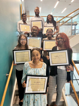 Summer Diversity Enrichment Academy participants displaying their academy completion certificates.