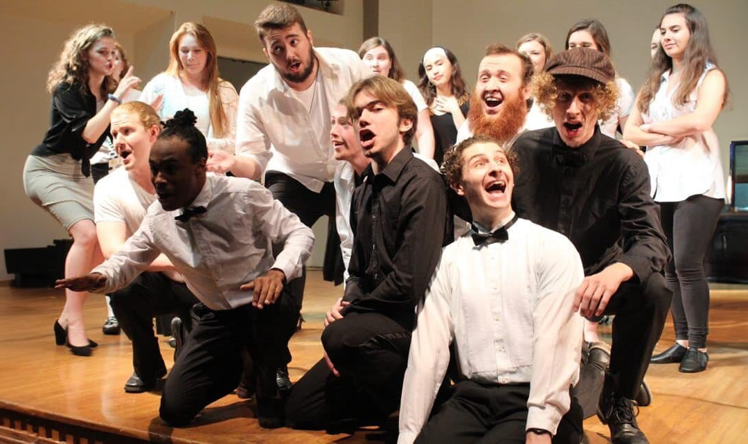 Students strike a variety of poses as part of their performance preparation in the Opera Workshop.