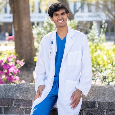 Ronit Pathak standing in front of the Medical University of SC hospital.