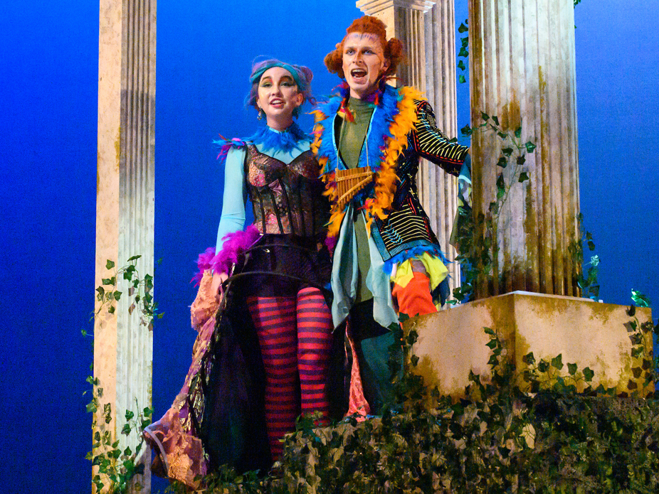 Two opera singers in colorful costumes perform in the College of Charleston production of The Magic Flute.