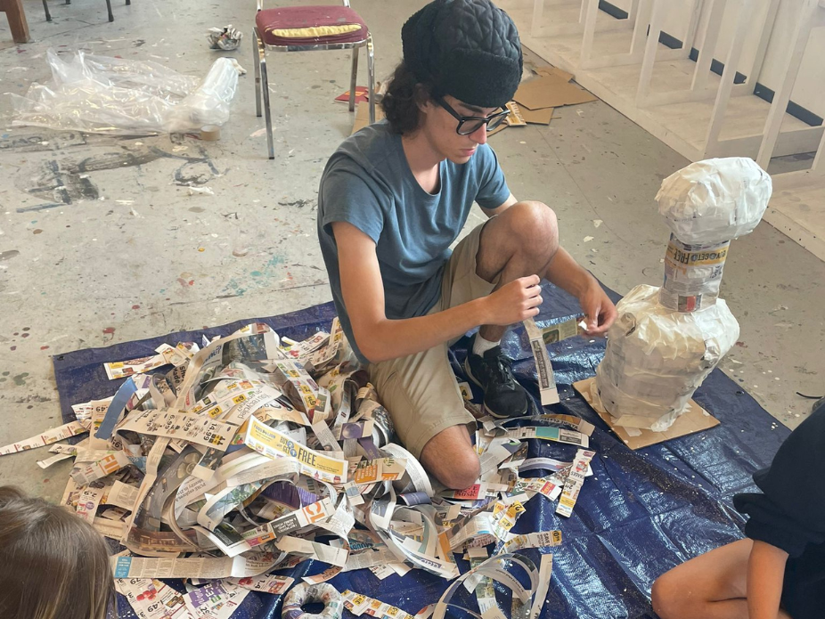 High school student participating in summer art camp