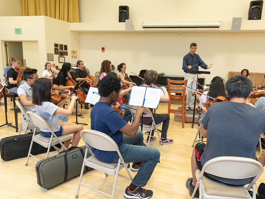 Philadelphia Eagles intern and CofC student Angelina Fierko holds up her name plate outside Lincoln Financial Field