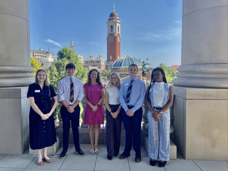 A group of students smiling outside