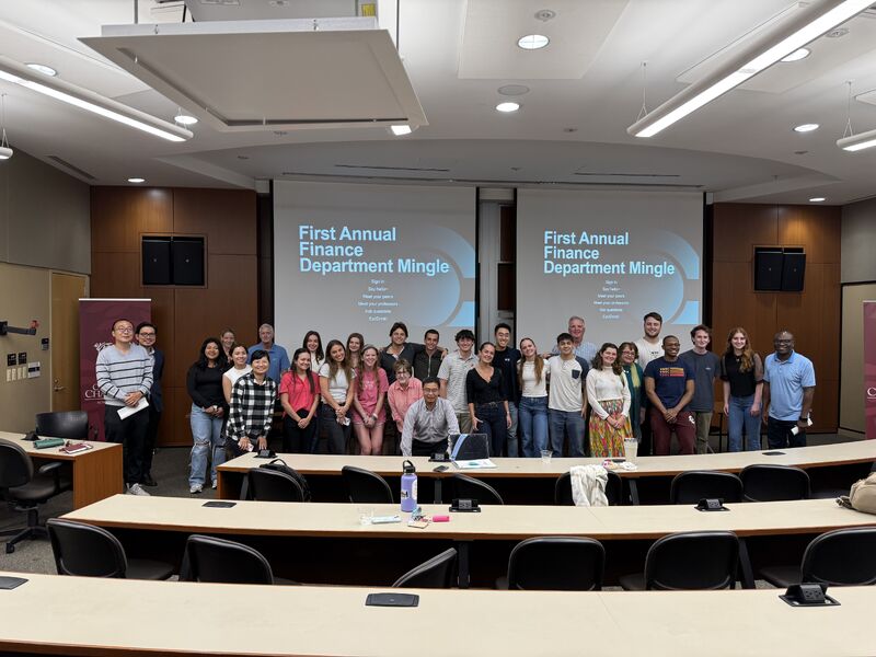 Large group posing in a large classroom