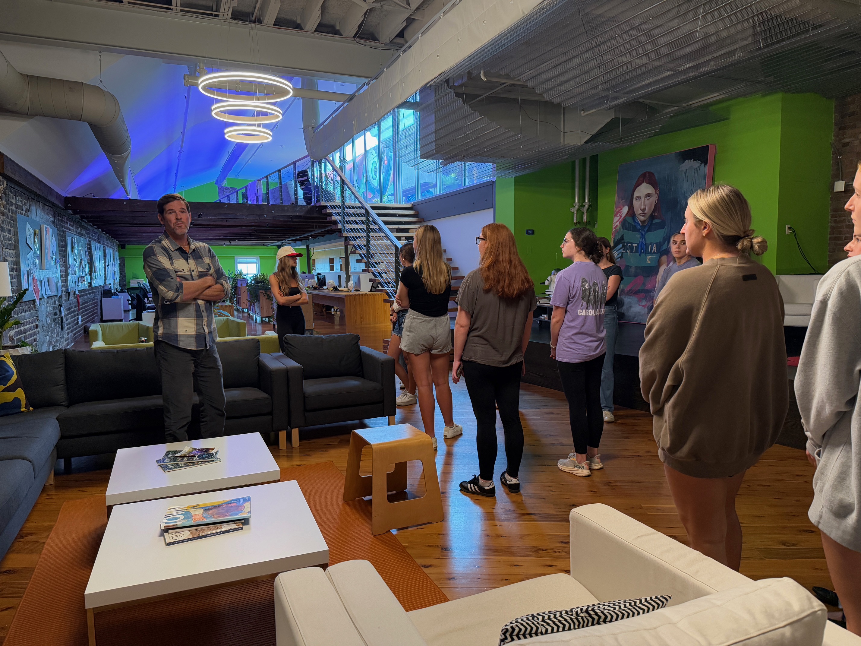 A man presenting to a group of students during a tour