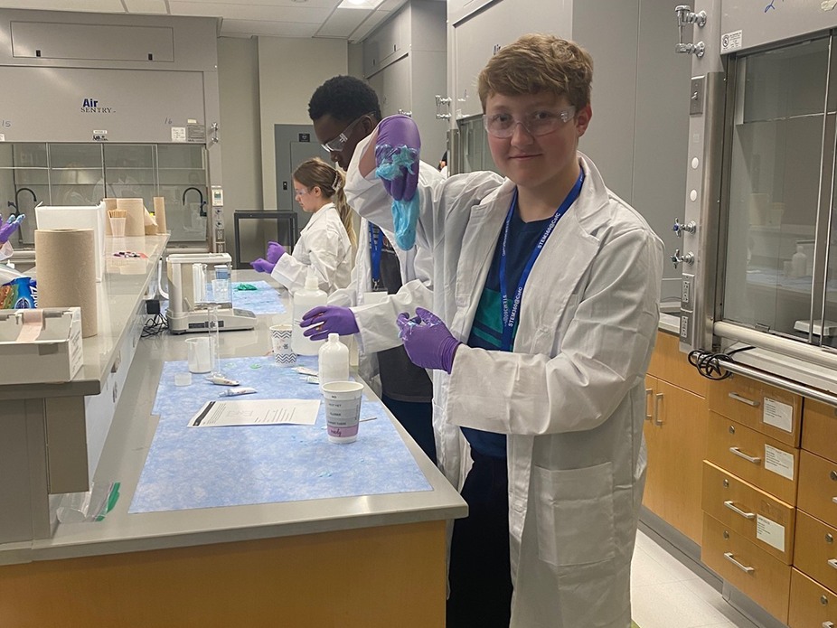 Students doing chemistry and making slime.