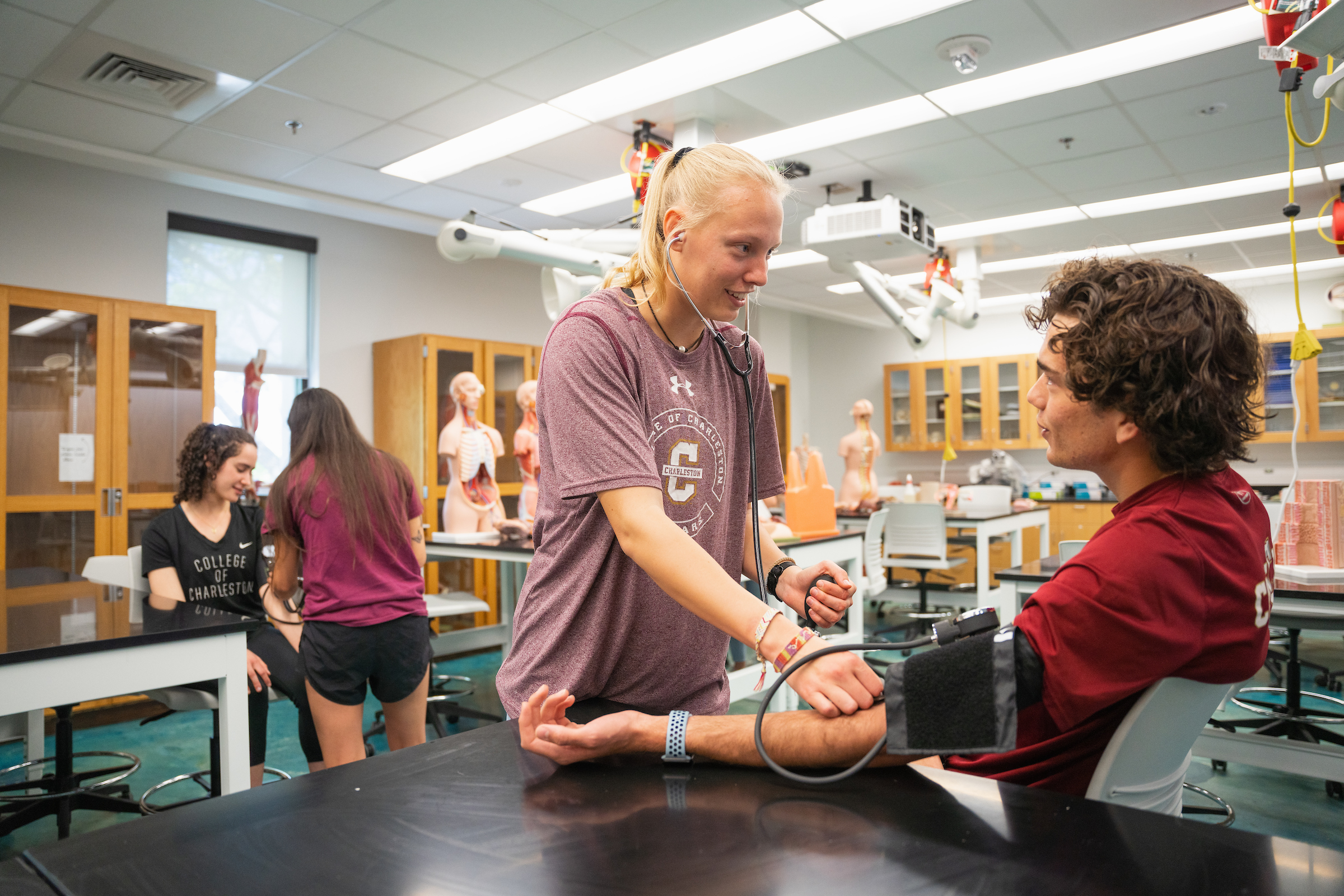 Two College of Charleston students getting hands-on experience in health sciences.