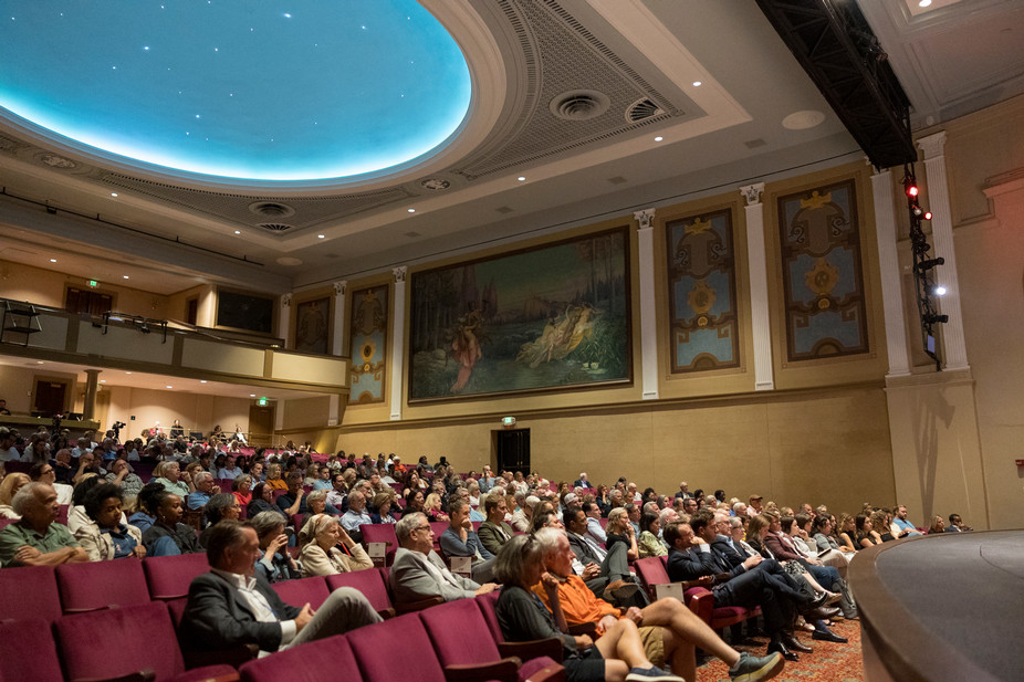 theatre event with lots of people seated in the audience