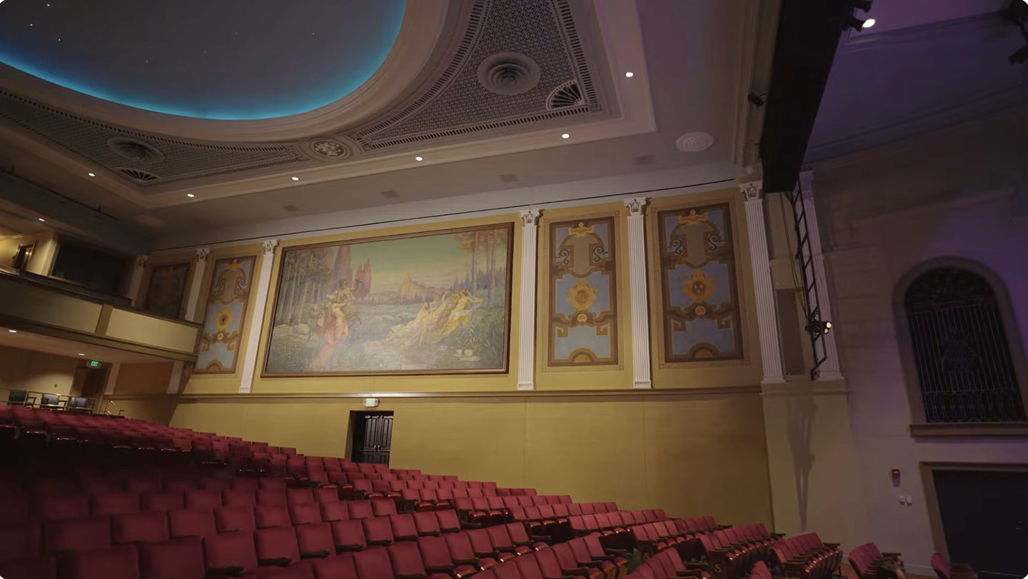 thumbnail of video, showing inside of theater with seats and historic mural