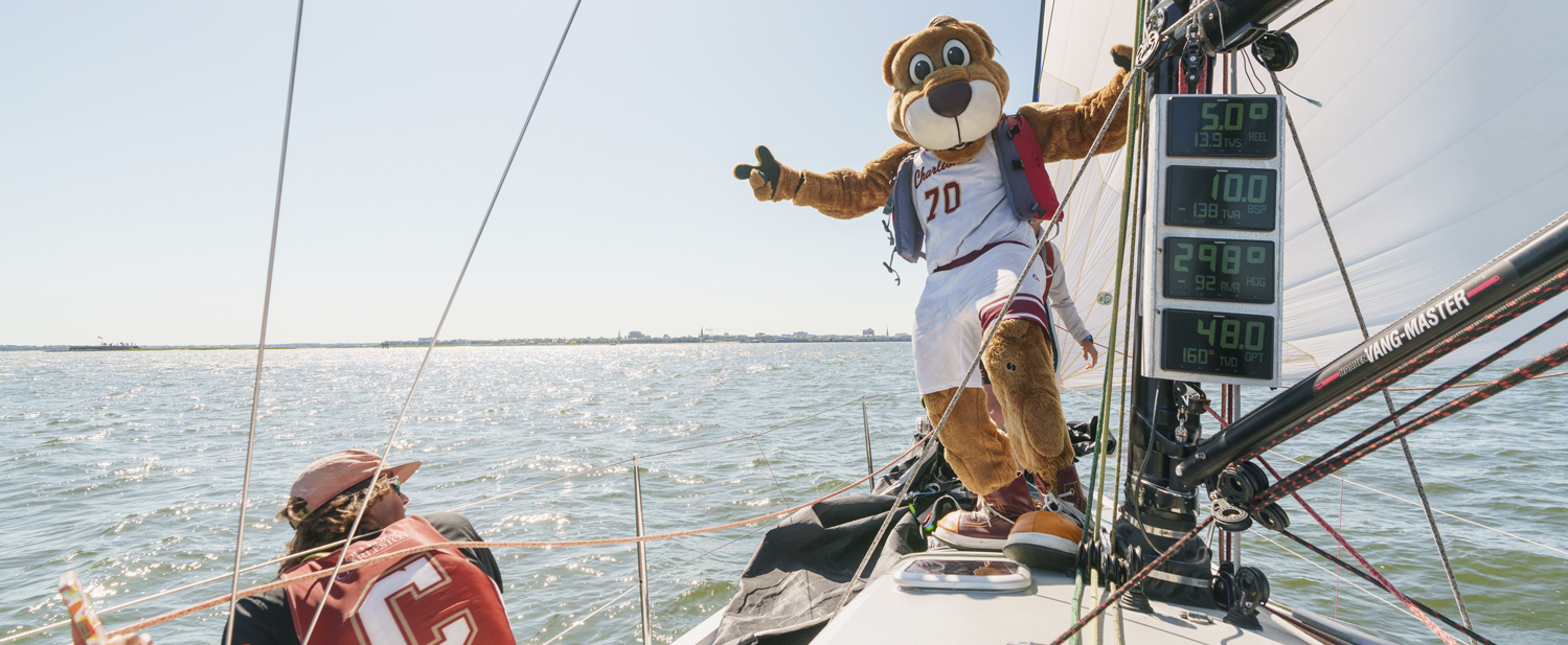 Clyde the Cougar mascot sailing with the College of Charleston sailing team.