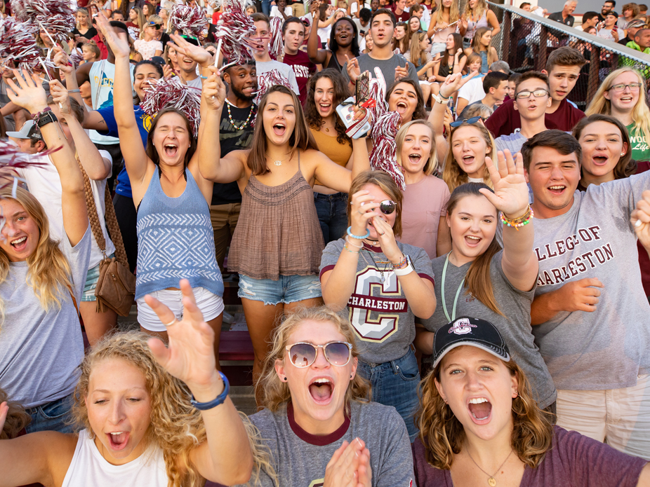 College of Charleston soccer fans stand up to cheer for the Cougars.