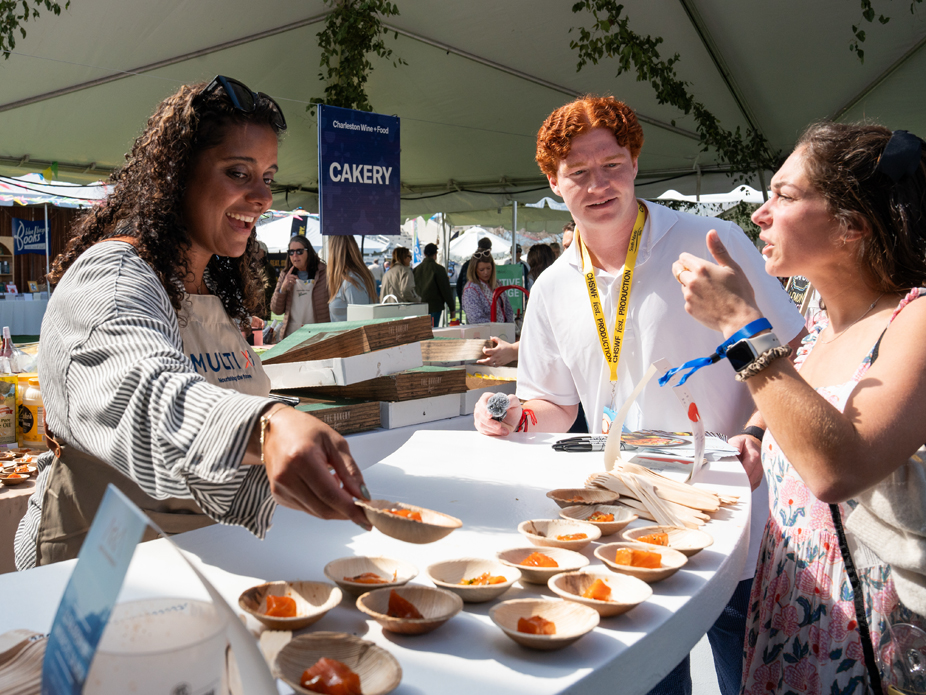 College of Charleston staff sample some cuisine at the annual Charleston Wine+Food Festival