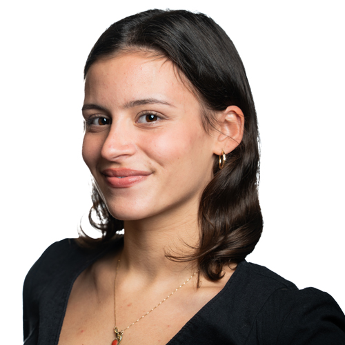 Portrait of Mia Sheyner, ayoung woman with long, black hairand a confident expression.